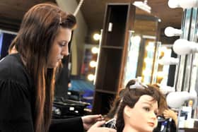 Hairdressing students working towards their NVQ at Balby Carr School.