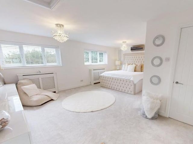 One of six bedrooms within the property.