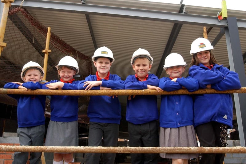 A 2003 image showing children inspecting the new sports hall on the nursery site.