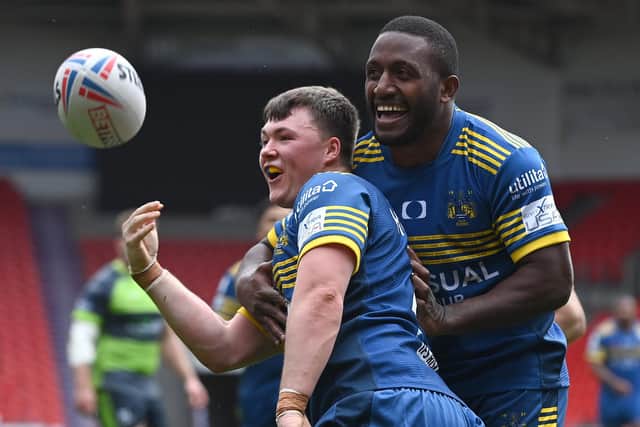 Dons' Alex Holdstock celebrates his try with Watson Boas. Photo: Andrew Roe/AHPIX LTD