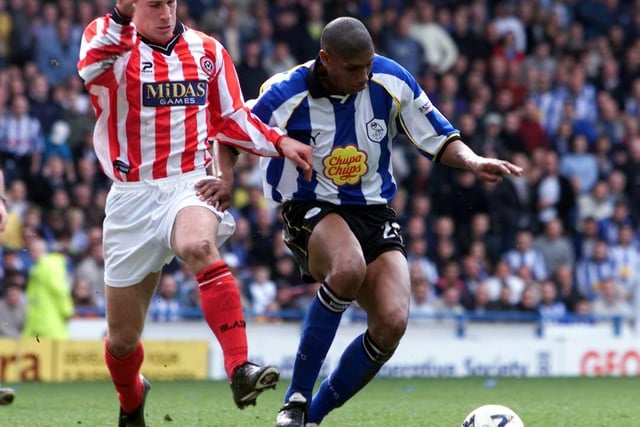 Carlton Palmer battles for possession with United's Nick Montgomery in April 2001.