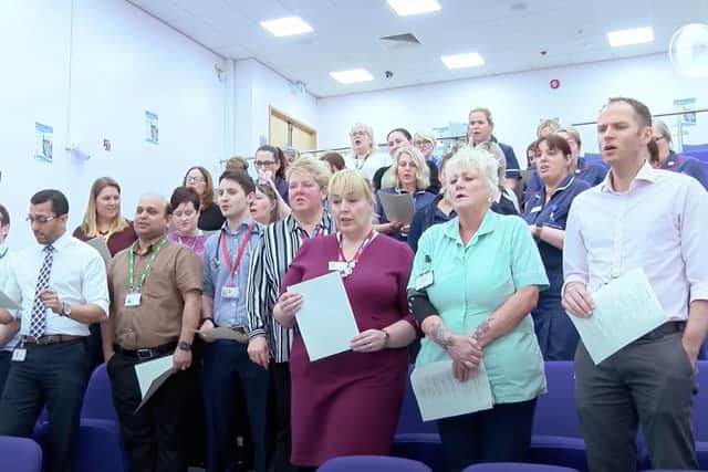 Workers at Doncaster and Bassetlaw Hospitals Trust performing a dance routine