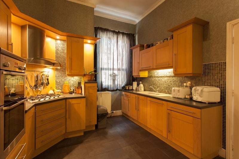 The kitchen features a five cylinder gas hob, double electric oven and integrated microwave.