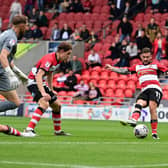 Jon Taylor goes close with a shot against Harrogate on the opening day.