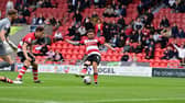 Jon Taylor goes close with a shot against Harrogate on the opening day.