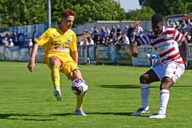 Kieran Agard crosses the ball in Doncaster's friendly against Nuneaton last weekend.