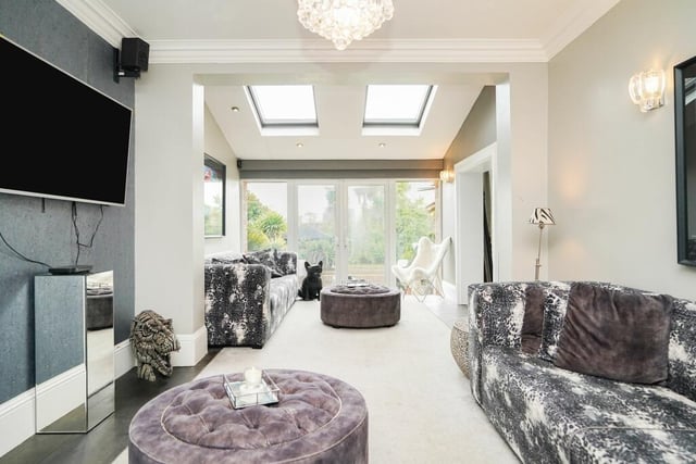 Relaxed living space attracts natural light and has access to the garden.