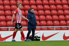 Ollie Younger, with Sunderland boss Lee Johnson. Picture: Frank Reid