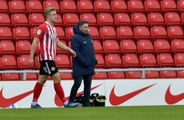 Ollie Younger, with Sunderland boss Lee Johnson. Picture: Frank Reid