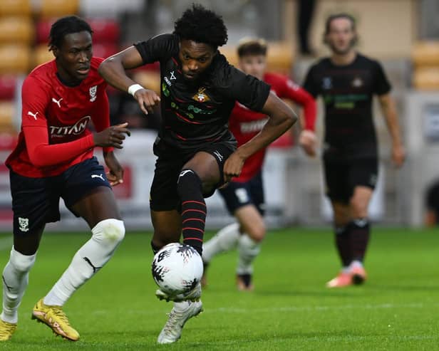 Deji Sontona gets away from a York City defender.