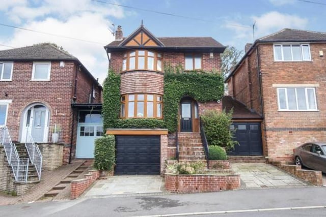 This four bedroom house has a conservatory at the foot of the tiered garden.