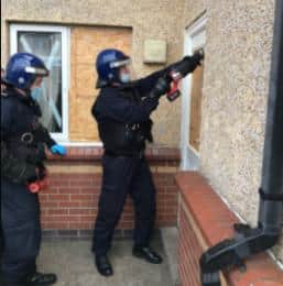 Police carrying out the drugs raid