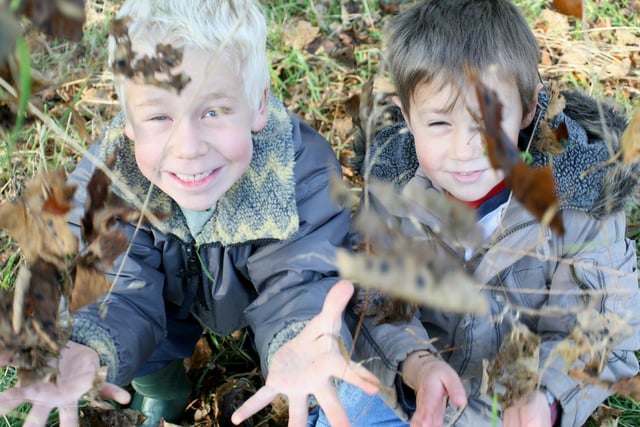 Alfie Hulbert, seven, and Robert Nicklin, seven, of Hathersage have fun collecting fallen autumn leaves to make collages at the Moorland Discovery Centre on the Longshaw Estate in 2007
