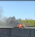 The vehicle burst into flames on the M18.