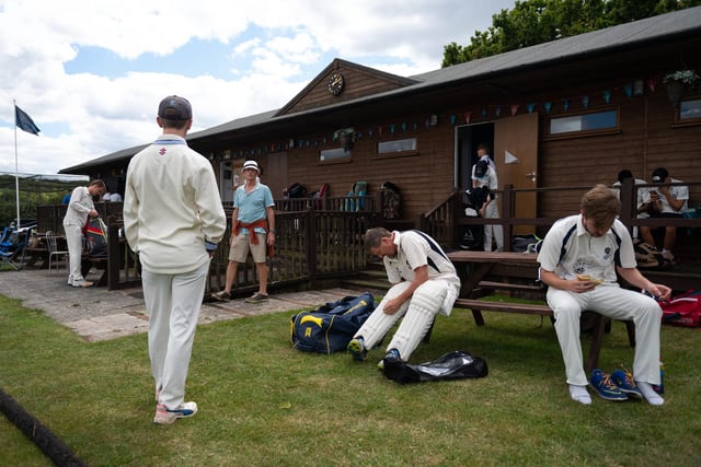 Players from Hambledon Cricket Club change outside the clubhouse to comply with social distancing measures as they return to action at Ridge Meadow. Pic: Jordan Pettitt/Solent News & Photo Agency