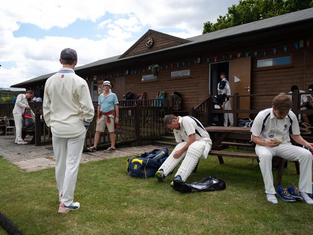 Players from Hambledon Cricket Club change outside the clubhouse to comply with social distancing measures as they return to action at Ridge Meadow. Pic: Jordan Pettitt/Solent News & Photo Agency