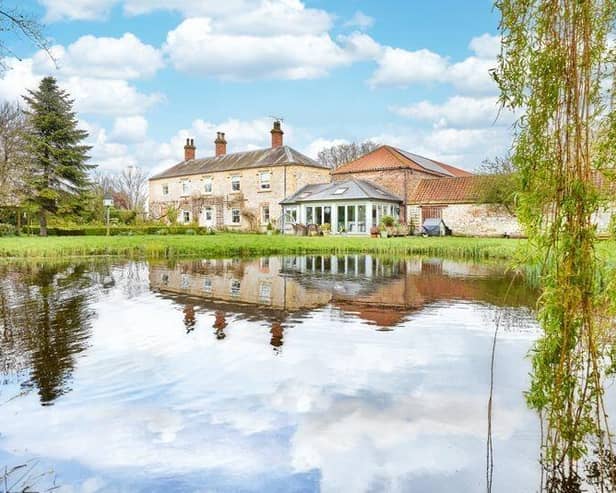 The stunning property comes with 10 acres, and its own lake within its grounds.