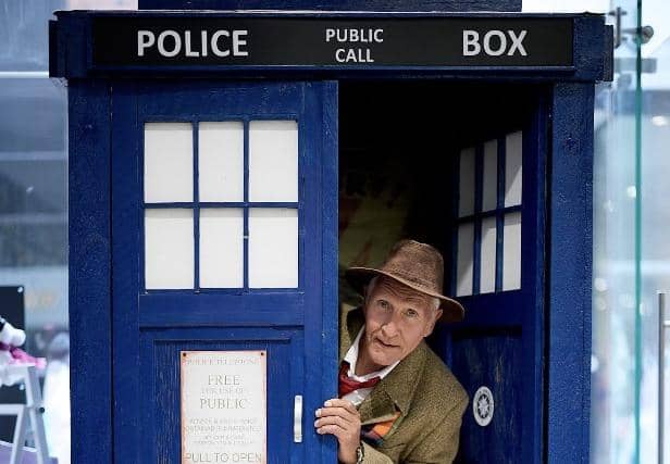 Ricky Butler inside his home made TARDIS.