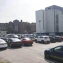 A nurse working at DRI has hit out at bosses over staff being chased for unpaid parking fines.