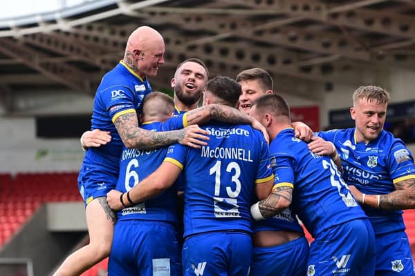 Dons celebrate a try during last season's win at home to Dewsbury.