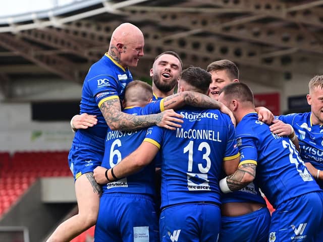 Dons celebrate a try during last season's win at home to Dewsbury.