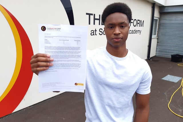 Tyreke Holness, of Southmoor Academy Sixth Form, shows off his results. Biology - A*, chemistry - A*, maths - A.