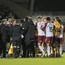 A touchline melee develops as Stephen Quinn is sent off at Sixfields. Photo by Chris & Jeanette Holloway/The Bigger Picture.media