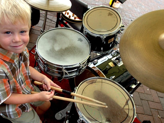 Mason Flannery, of Sprotbrough, drums up some customers at the Alliance and Leicester promotional stand in Doncaster on in 2006