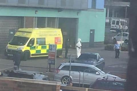 Ambulance and a person in a hazmat suit at the Flying Scotsman surgery.
