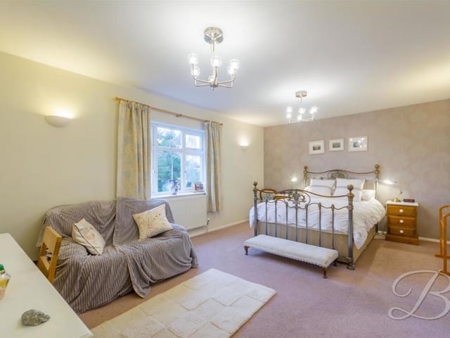 The first bedroom we look at is the master. It could hardly be a better size with space for sofa and dressing table or desk. It also has its own en suite and dressing room, adding a touch of high living!