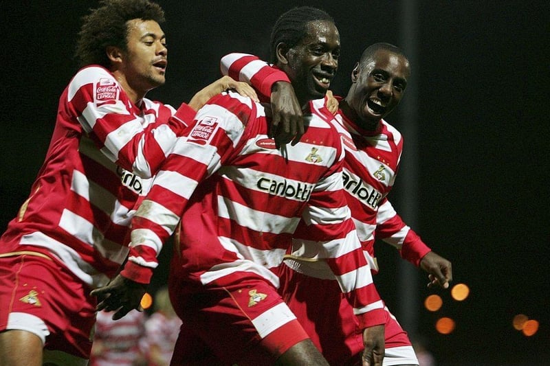 Mark McCammon is congratulated by team-mates after scoring during the FA Cup second round replay between Doncaster Rovers and Mansfield Town at Belle Vue on December 12, 2006.