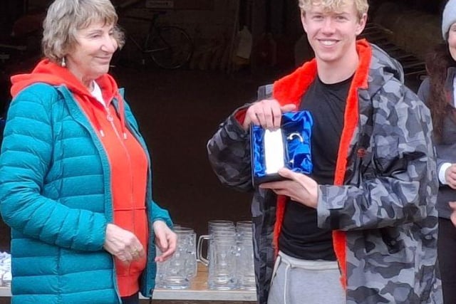 Mike's mother presenting his award to Liam Carroll (Burton Leander)