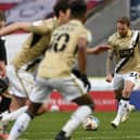James Coppinger curls in his free kick deep into injury time to secure Rovers a point against Hull City. Picture: Howard Roe/AHPIX