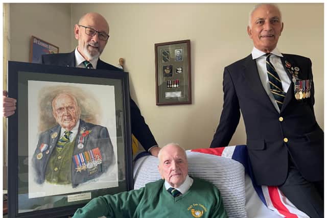 WW2 veteran Fred Adamson was presented with a portrait of himself by artist Graham Colbeck and Tim Humphreys of the KOYLI associaton.