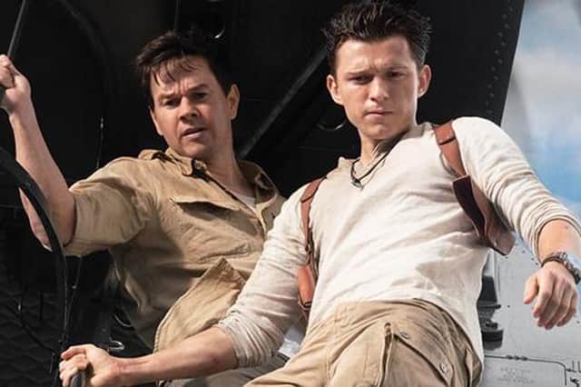 Mark Wahlberg stars as Victor “Sully” Sullivan and Tom Holland is Nathan Drake in Columbia Pictures' UNCHARTED.  Photo by: Clay Enos
