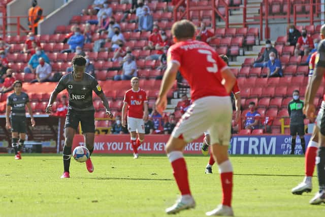 Madger Gomes lines up his shot for Rovers' opening goal as Charlton supporters watch on. Picture: Gareth Williams/AHPIX