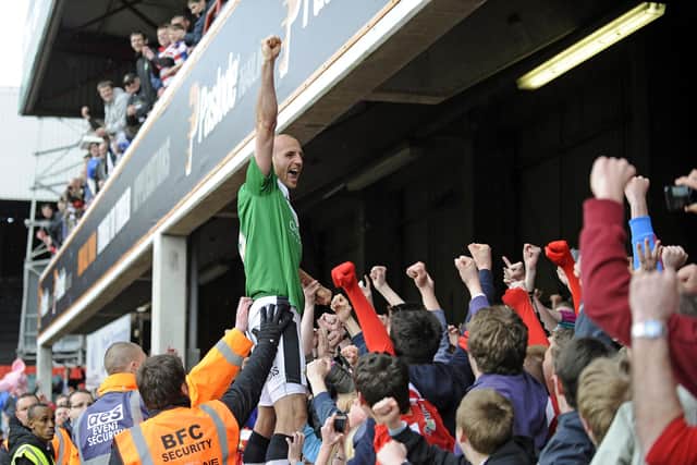 Rob Jones celebrates winning the League One title with Rovers at Brentford