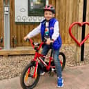 Young cyclist Edwin Woolley at a bicycle repair station