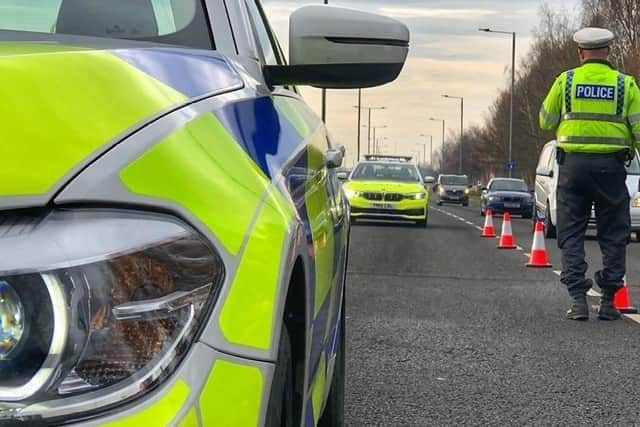 The A1 was closed for several hours after a mini bus carrying football fans overturned near Doncaster.