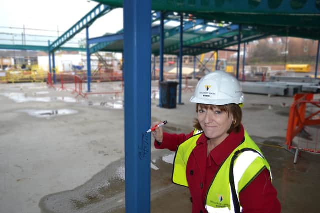 Councillor Nuala Fennelly, Doncaster Council cabinet member for Children’s Services, signing a steel beam at the under-construction Carr Lodge Academy