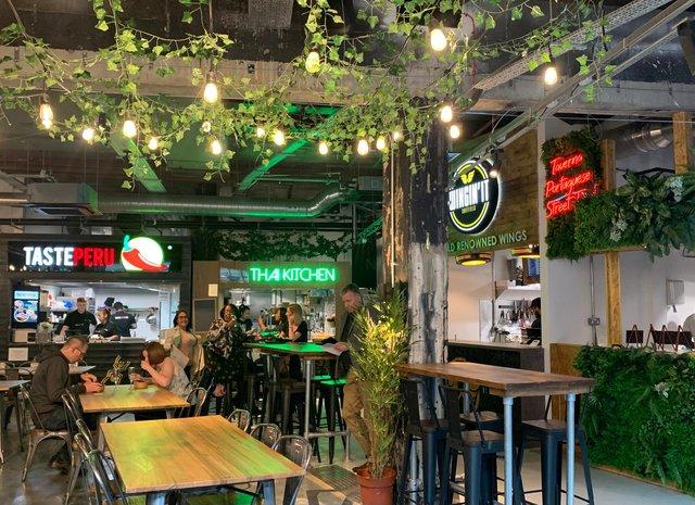 The new food hall in Orchard Square features a number of street food vendors with cuisines from around the world, as well as a bar serving cocktails, beers, wines and spirits.
