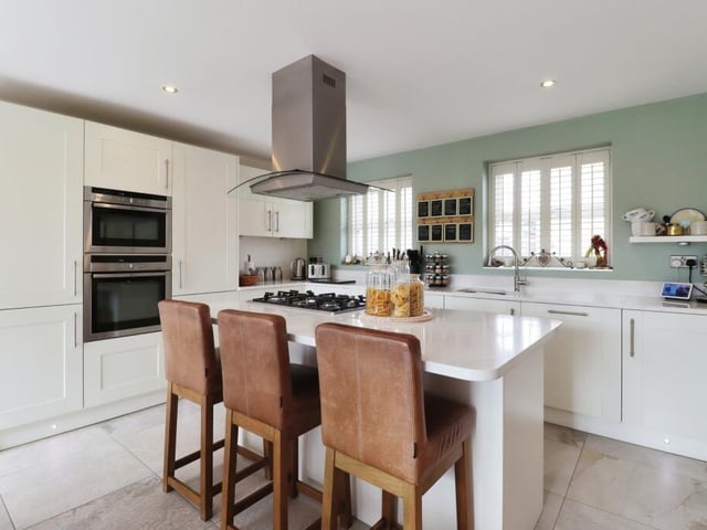 A well-equipped, modern kitchen with central island.