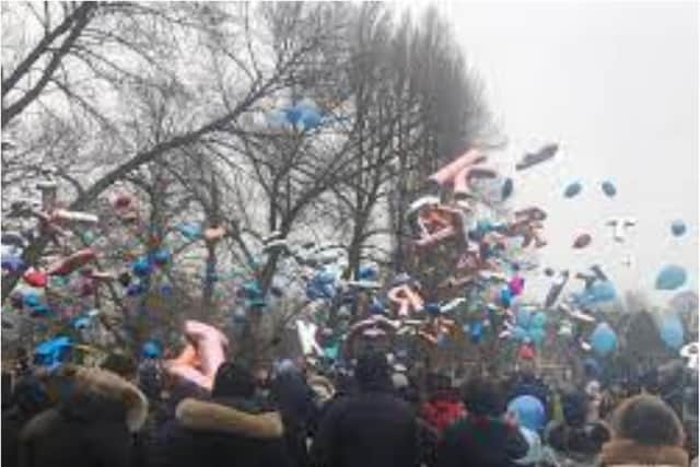 Balloons were released in memory of Ryan and Janis in Elmfield Park.