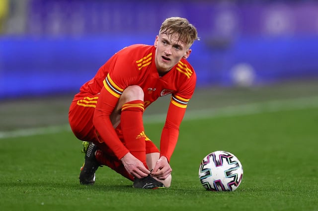 Matt Smith in action for Wales against Mexico