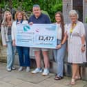 Jeff Lockhart (centre) is pictured with (left to right) Evie Fox, Kath Horsfield, Megan Downey and Fundraiser Maureen Harwood.