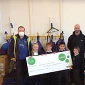 Representatives from Ikea hand over a cheque for £2,000
