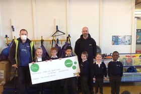 Representatives from Ikea hand over a cheque for £2,000