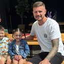 The couple with their adopted twins Theo and Savannah.