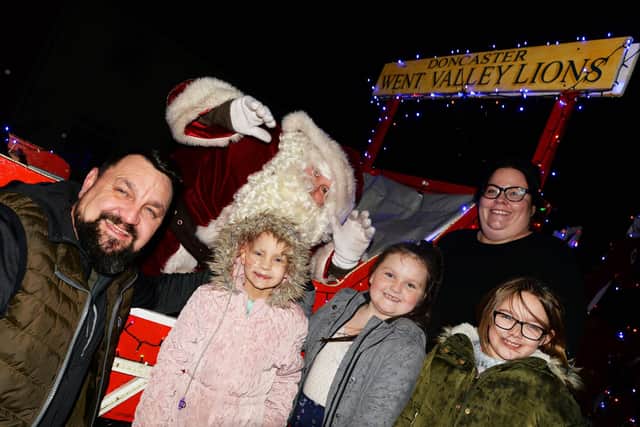 Santa Claus pictured with Myla Carte, five, her parents Trev and Lyndsey, her sister Maicie, eight and her cousin, Freya Gilliland, eight. Picture: NDFP-18-12-18-CarteSanta-5
