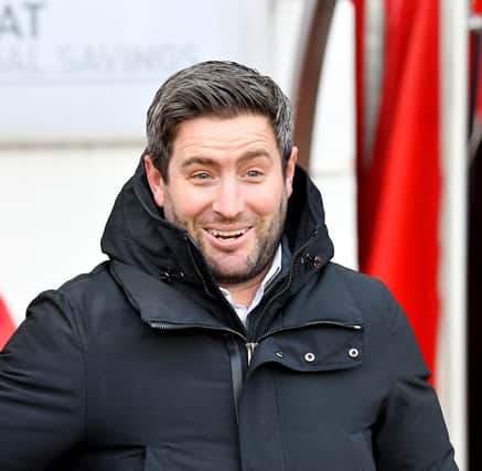 Lee Johnson will take a youthful squad to Spennymoor on Saturday afternoon